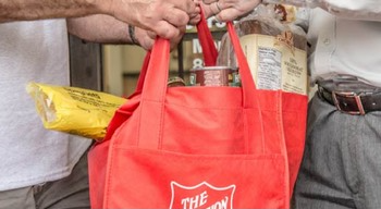 A client being helped with groceries