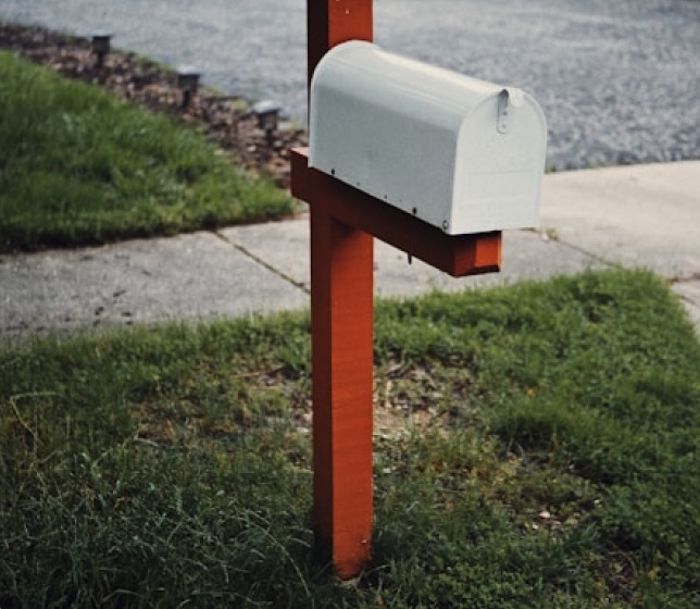 A mailbox painted in red and white